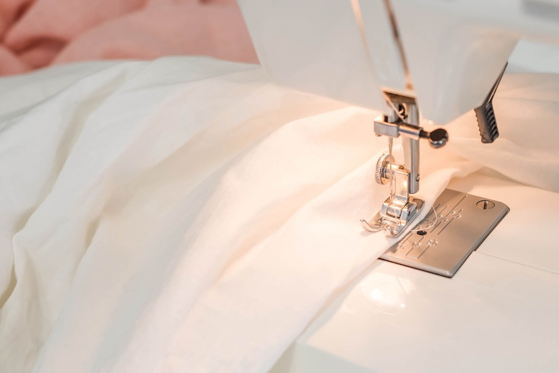sewing-machine-white-fabric-sewing-tailor